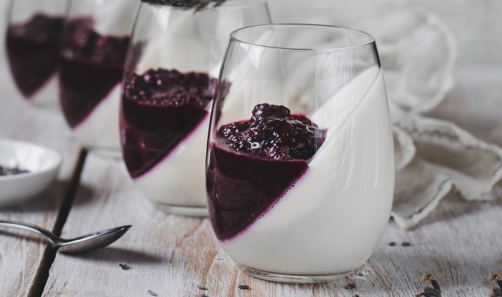 lavender infused blackberries on top of panna cotta desserts