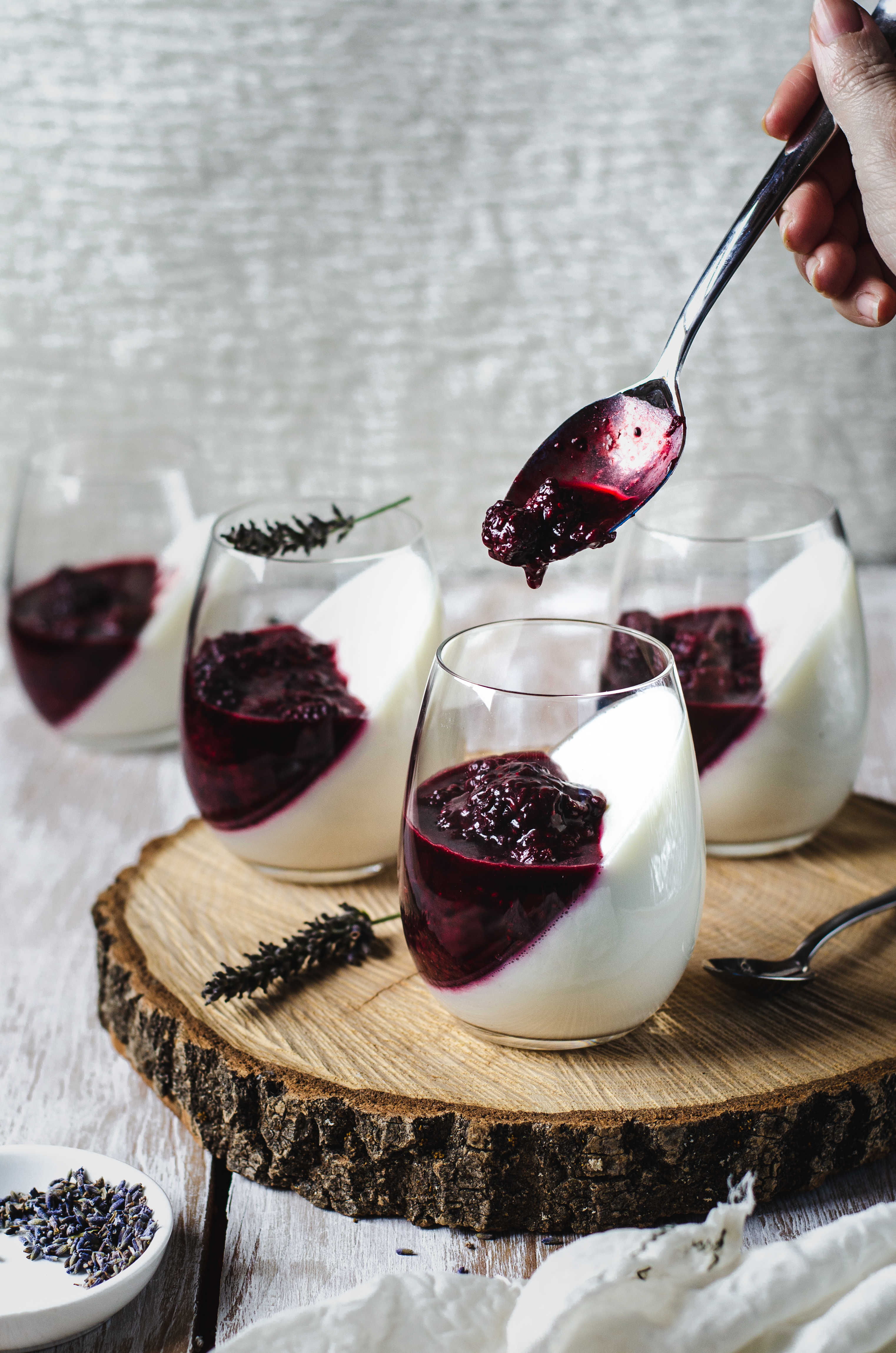four glasses of lavender blackberry panna cotta with Greek yogurt