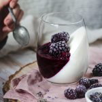 lavender blackberry panna cotta with Greek yogurt served in a stemless wine glass